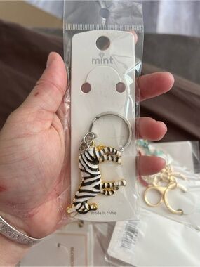 4/$50 Mint Zebra Enamel Keychain - White, Black & Gold